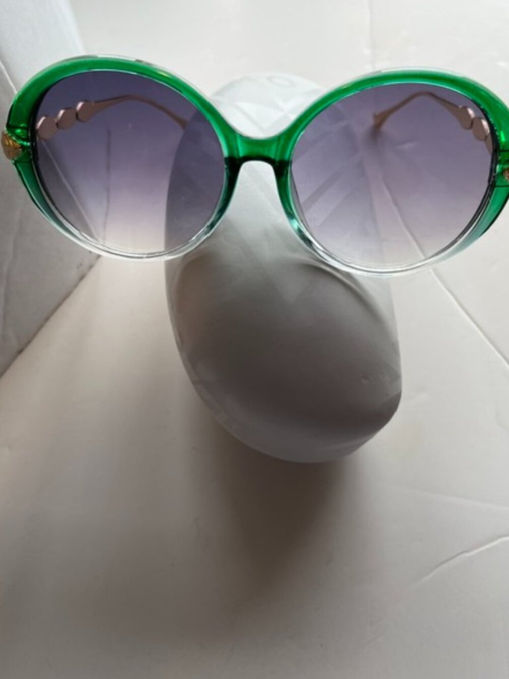 Green mod style sunglasses.